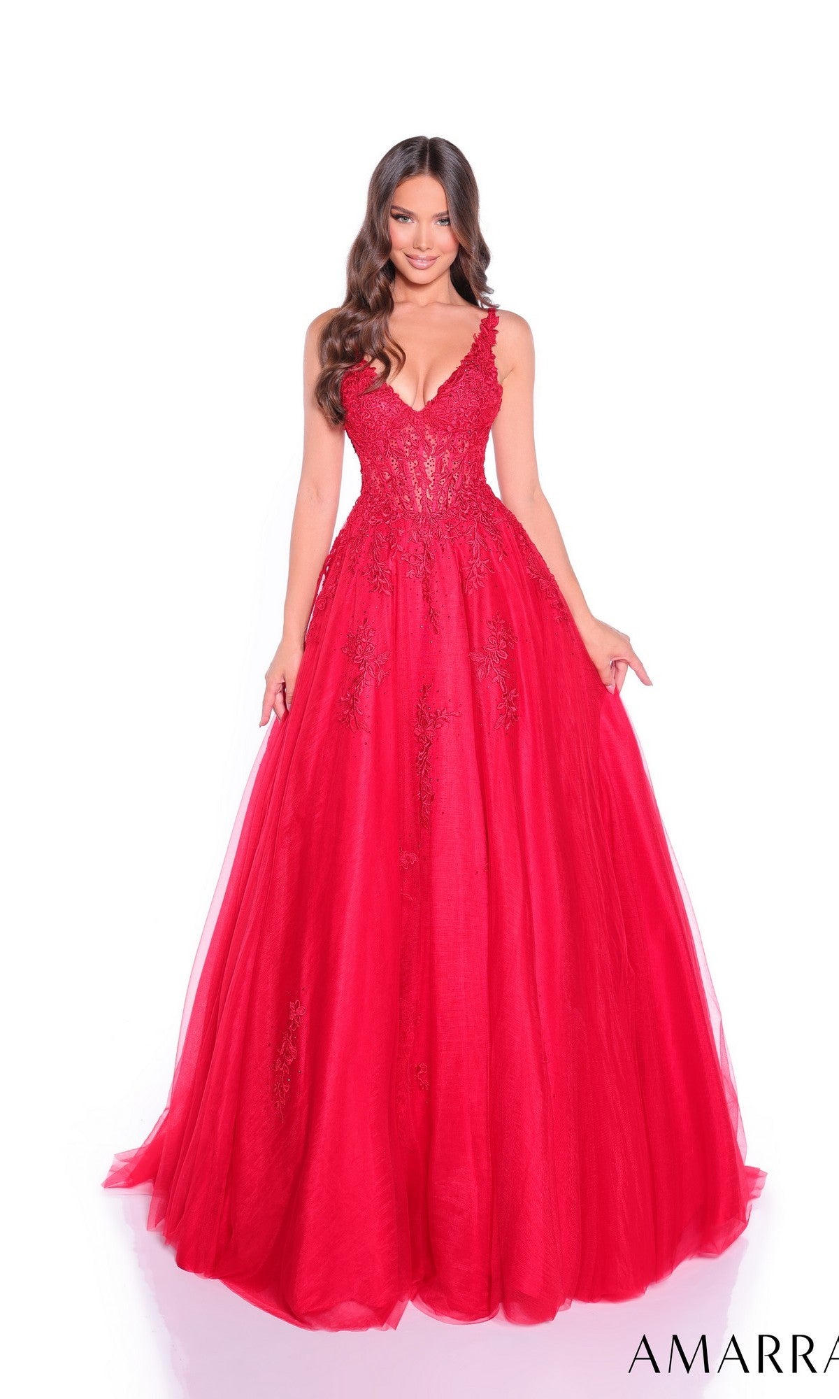 A woman stands against a plain white background wearing the red Sheer-Waist Long A-Line Prom Dress, Amarra 89523, a sleeveless, floor-length gown with embroidered lace detailing.